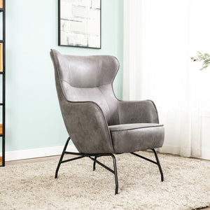 The Mason Armchair in Charcoal features a curvy, edgy design with vintage-inspired leather upholstery providing stylish comfort.