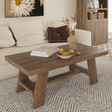 Wooden coffee table with decorative items in a living room setting