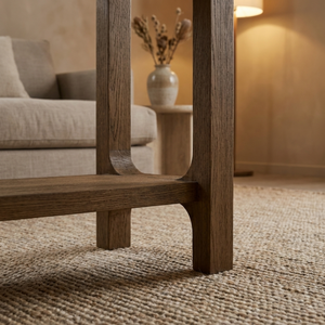 Wooden console table in a living room setting with a blurred background