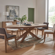 The Foxford Medium Oval Dining Table in Smoked Oak is crafted with stylish smoked oak veneer and supported by solid oak legs.