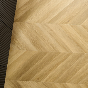 The Menor Oak Chevron SPC Flooring features elegant chevron design, waterproof mineral core, 25 year warranty and Titanium Nano finish for durability