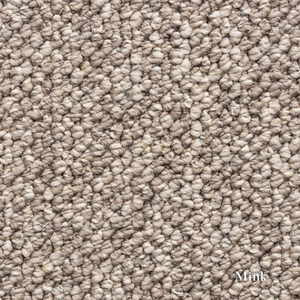 Close-up of textured beige carpet with 'Mink' label