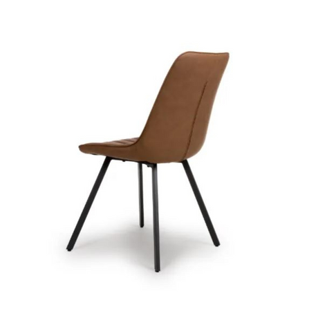 The Miro Chair in Tan & Truffle features faux leather and black metal legs that is elegant and easy to clean, enhancing any dining room experience