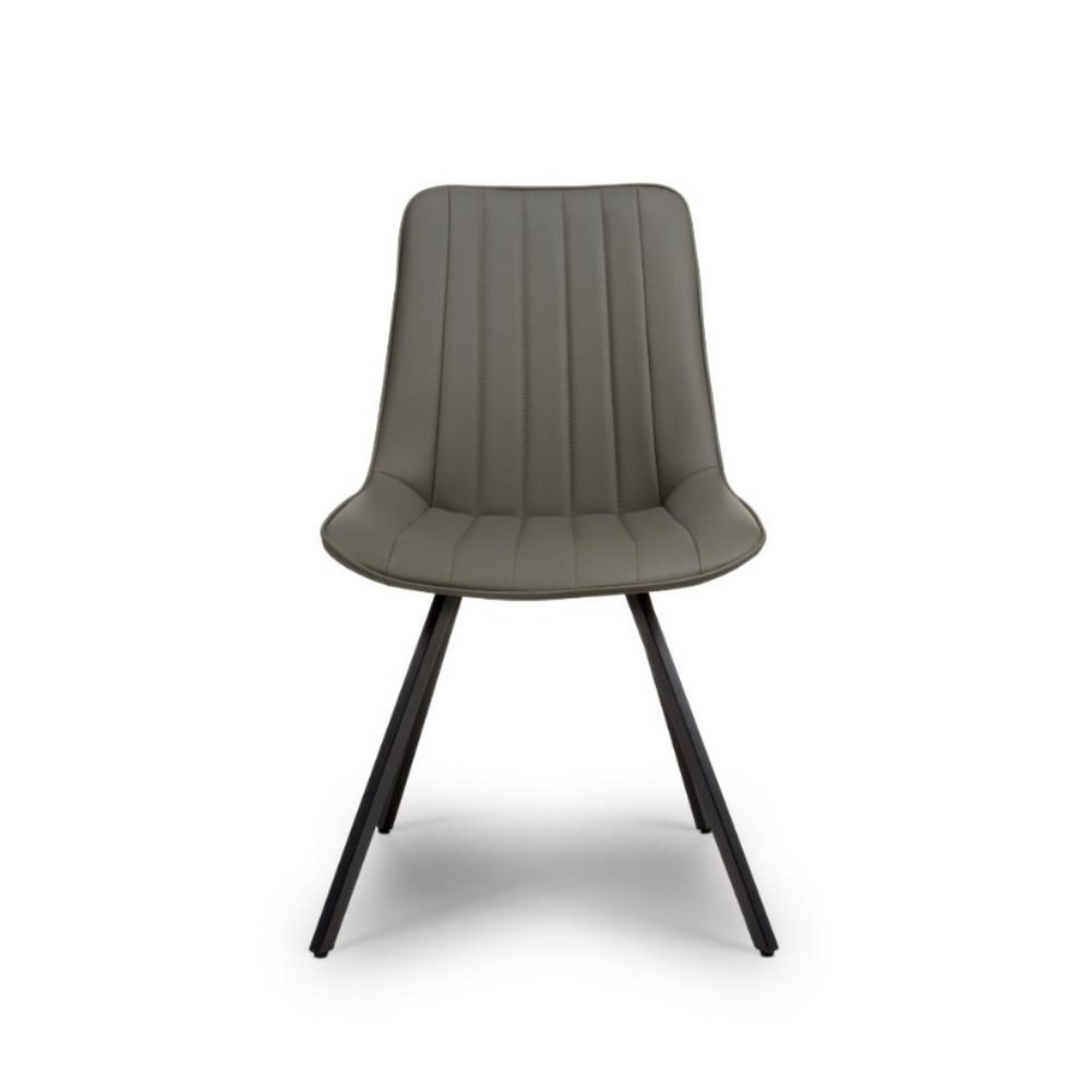 The Miro Chair in Tan & Truffle features faux leather and black metal legs that is elegant and easy to clean, enhancing any dining room experience