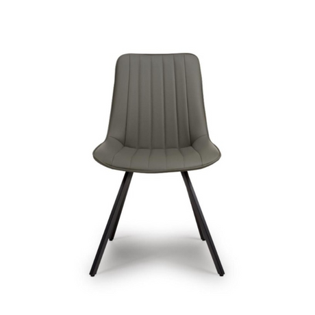 The Miro Chair in Tan & Truffle features faux leather and black metal legs that is elegant and easy to clean, enhancing any dining room experience