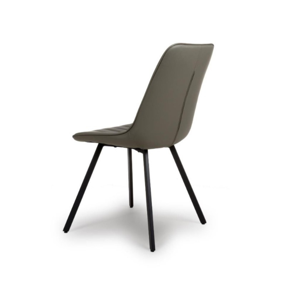 The Miro Chair in Tan & Truffle features faux leather and black metal legs that is elegant and easy to clean, enhancing any dining room experience