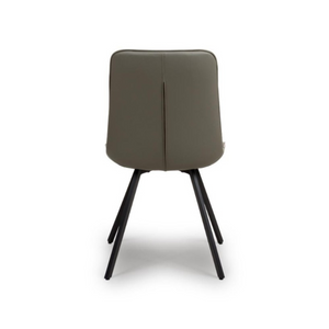The Miro Chair in Tan & Truffle features faux leather and black metal legs that is elegant and easy to clean, enhancing any dining room experience