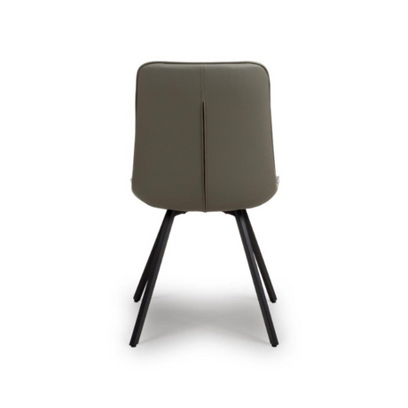 The Miro Chair in Tan & Truffle features faux leather and black metal legs that is elegant and easy to clean, enhancing any dining room experience