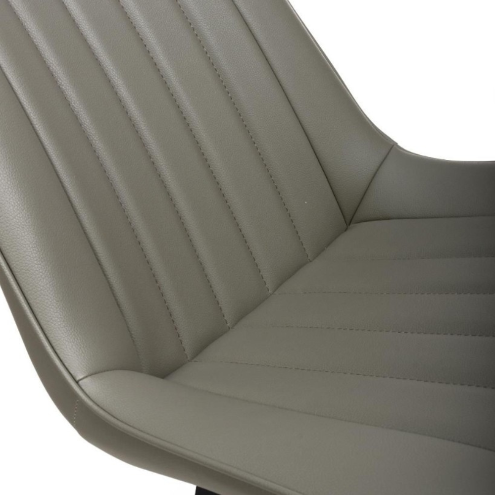 The Miro Chair in Tan & Truffle features faux leather and black metal legs that is elegant and easy to clean, enhancing any dining room experience