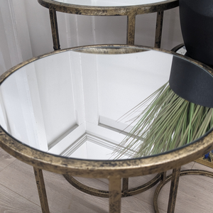 Add elegance with the Mirror Top Nest of Tables with an antique gold finish, mirrored tops and stackable design make this set of 3 stylish and practical