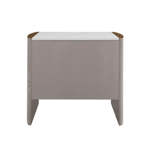 The Mondello 2 Drawer Bedside Table in Washed Oak features a luxurious sintered stone top, stainless steel accents and ample storage for a modern bedroom
