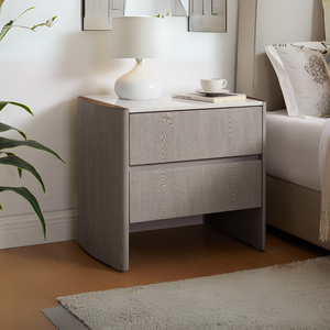 The Mondello 2 Drawer Bedside Table in Washed Oak features a luxurious sintered stone top, stainless steel accents and ample storage for a modern bedroom