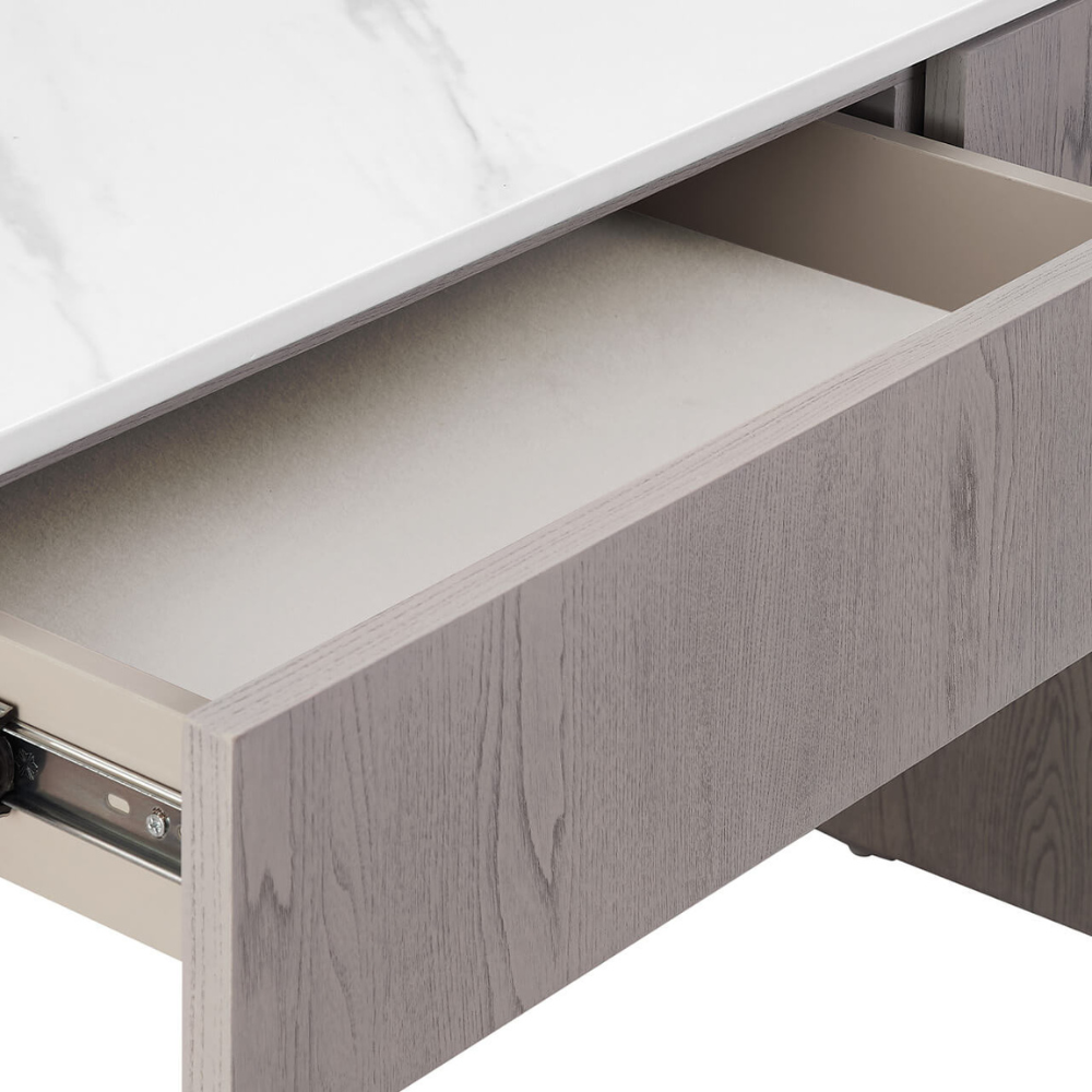 The Mondello 2 Drawer Dressing Table in Washed Oak features a luxurious sintered stone top, sleek steel accents and storage for a stylish practical bedroom