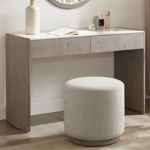 The Mondello 2 Drawer Dressing Table in Washed Oak features a luxurious sintered stone top, sleek steel accents and storage for a stylish practical bedroom