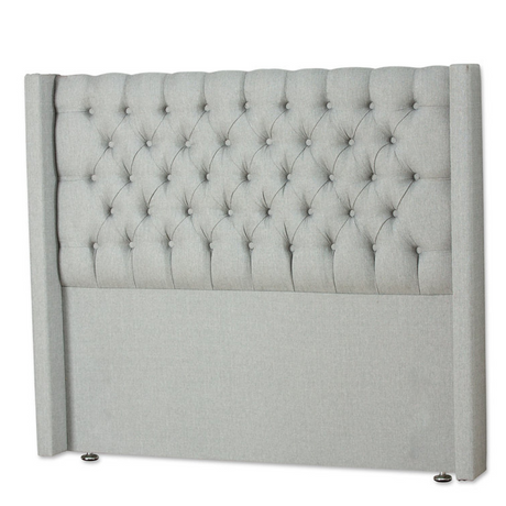 The Monika Fabric Headboard - 56" features elegant deep button Chesterfield design, custom fabric and floor standing with chrome gliders, ideal for any bed!