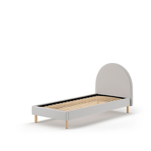 The Moon Kids Bed 90 x 200cm in Grey Boucle features a rounded headboard, soft upholstery and durable frame that is both cozy and stylish for any child