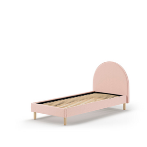 The Moon Kids Bed 90 x 200cm in Pink Boucle features a rounded headboard, soft upholstery and durable frame that is both cozy and stylish for any child