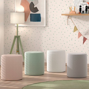 The Moon Kids Stool in Boucle is available in pink, white, grey and olive green, soft upholstery, multifunctional design and Belgian style