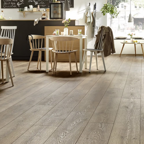 The Mountain Oak Brown Laminate Flooring - 10mm features AC5 heavy-duty, realistic oak texture and rich chocolate tones.
