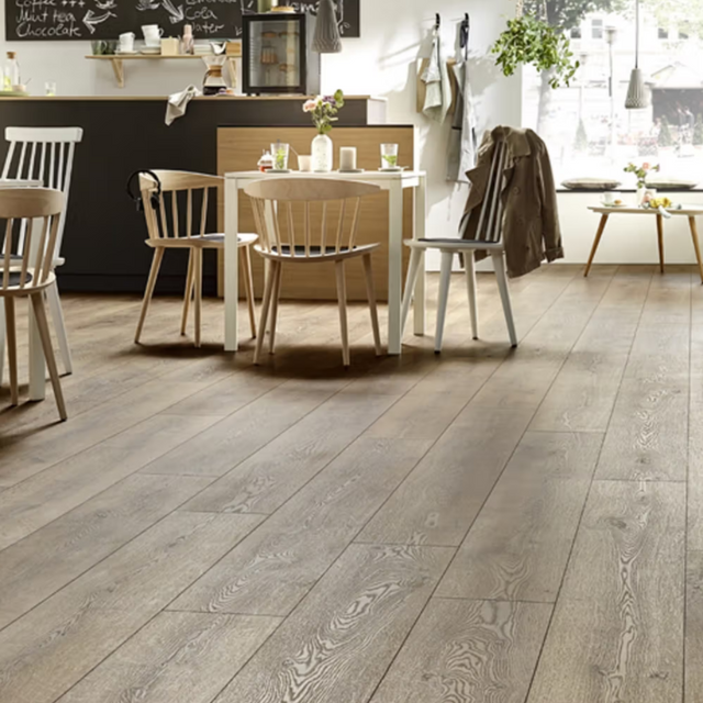 The Mountain Oak Brown Laminate Flooring - 10mm features AC5 heavy-duty, realistic oak texture and rich chocolate tones.