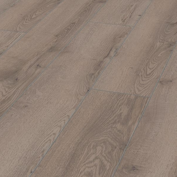 The Mountain Oak Grey Laminate Flooring 12mm features AC5 rated, long planks for a chic look and 5G installation compatible with underfloor heating.