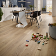 The Mountain Oak Nature Laminate Flooring - 12mm features AC5-rated for durability and long planks in a natural oak finish.
