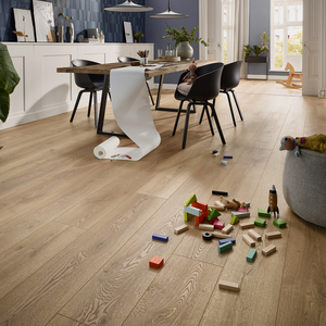 The Mountain Oak Nature Laminate Flooring - 12mm features AC5-rated for durability and long planks in a natural oak finish.