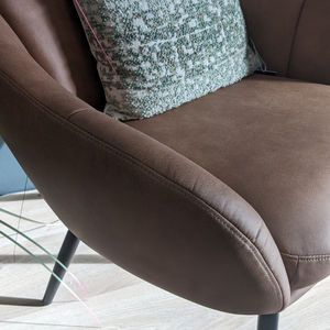 The Nates Accent Chair in Tan features durable fabric, sink in comfort and a compact stylish design, a versatile piece to elevate any modern living space