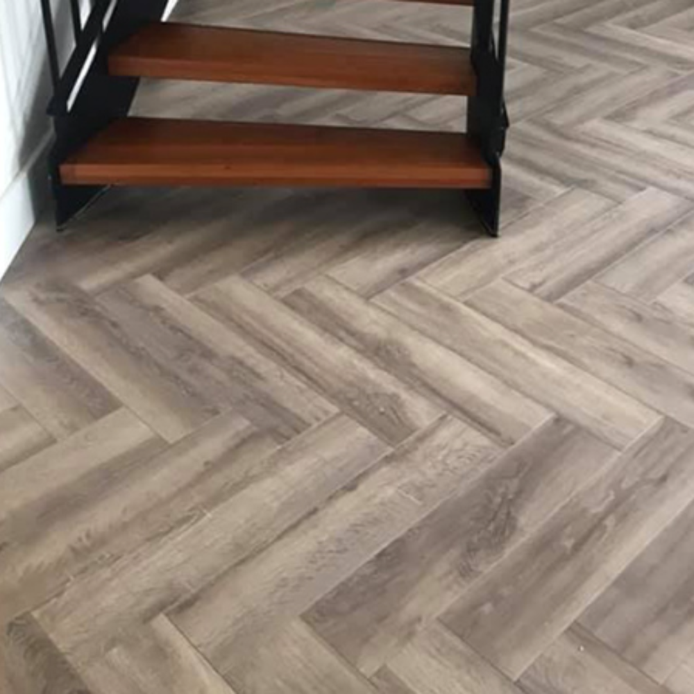The Nottingham Herringbone Laminate Flooring - 12mm, AC6-rated, underfloor heating compatible, 30-year warranty