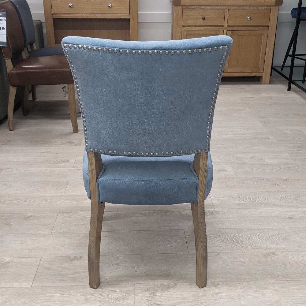 The Ontario Leather & Velvet Dining Chair offers the Ink Blue and Tan in leather and Grey, Dark Grey and Blue in velvet with a solid oak frame and legs