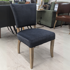The Ontario Leather & Velvet Dining Chair offers the Ink Blue and Tan in leather and Grey, Dark Grey and Blue in velvet with a solid oak frame and legs