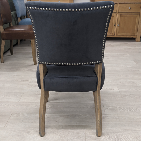 The Ontario Leather & Velvet Dining Chair offers the Ink Blue and Tan in leather and Grey, Dark Grey and Blue in velvet with a solid oak frame and legs