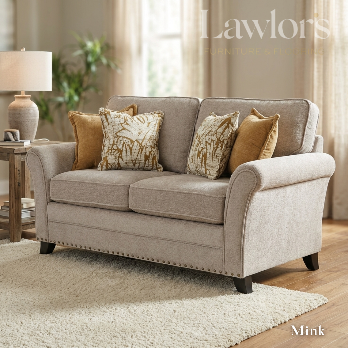 Mink 2 seater fabric sofa with patterned cushions in a living room setting