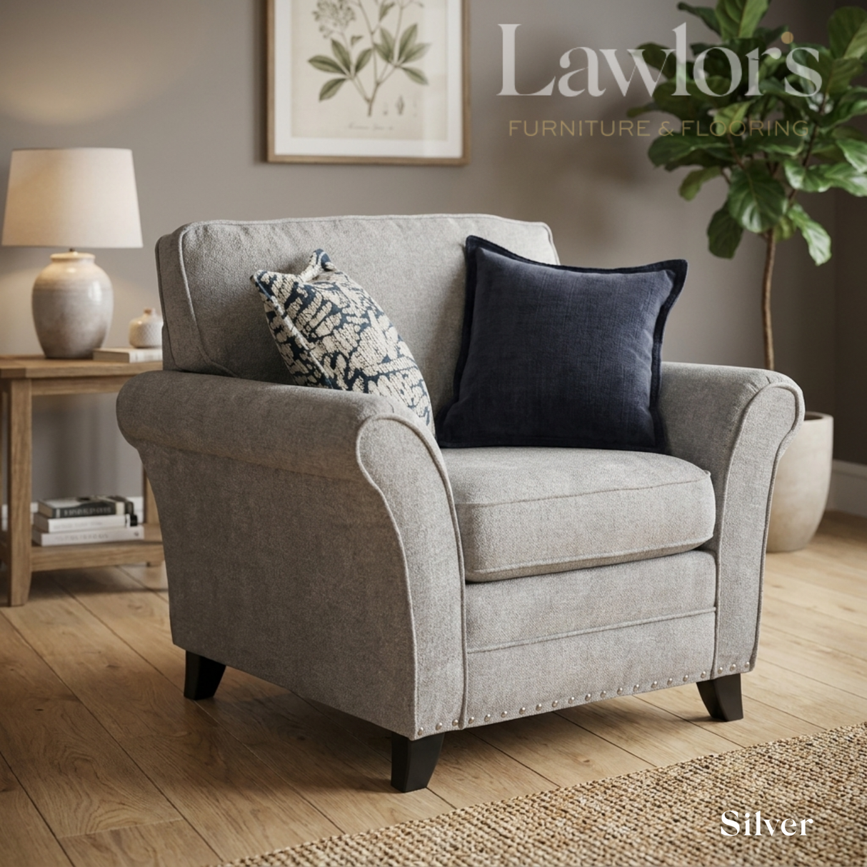 Silver fabric armchair with decorative pillows in a living room setting