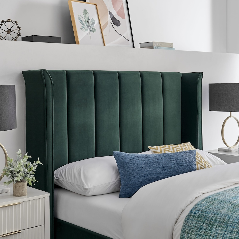 The Palmer Bed in Emerald Green in 4ft6 Double and 5ft King features a 134cm headboard, recycled velvet and winged design, where eco-friendly meets luxury
