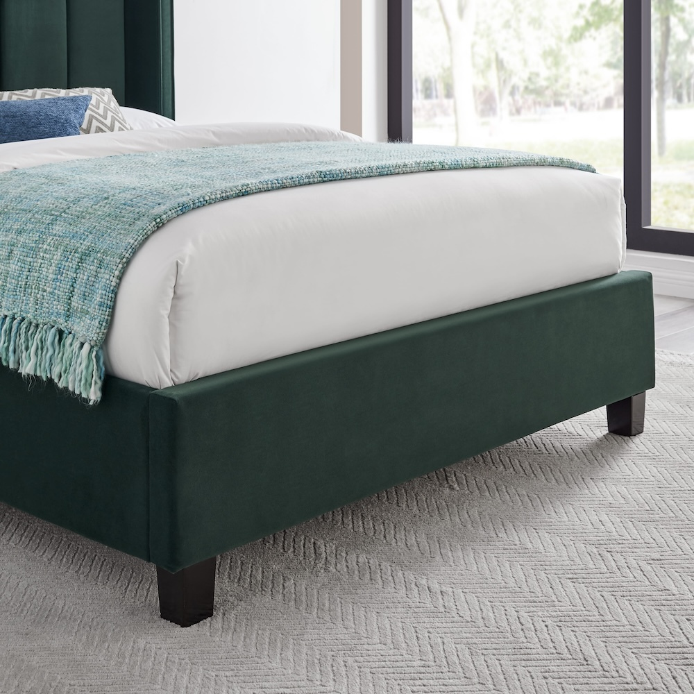 The Palmer Bed in Emerald Green in 4ft6 Double and 5ft King features a 134cm headboard, recycled velvet and winged design, where eco-friendly meets luxury