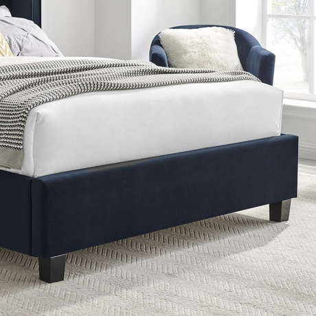 The Palmer Bed in Navy comes in 4ft6 Double and 5ft King featuring a 134cm headboard, recycled velvet and winged design, where eco-friendly meets luxury