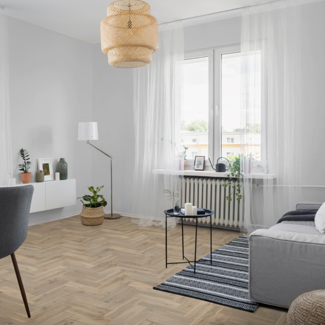 The Pearl Grey Oak Herringbone Engineered Flooring - 15mm features natural oak grains, multi layer stability and a brushed lacquer finish