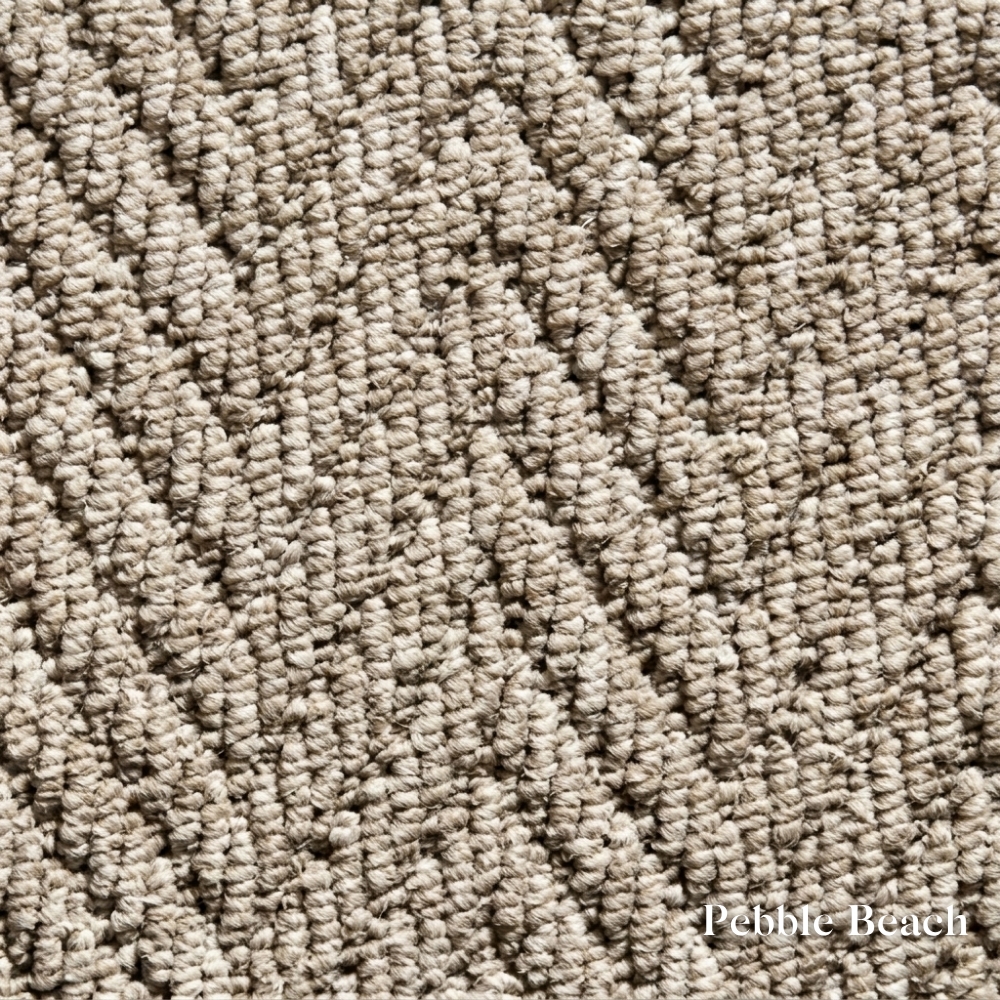 Close-up of textured beige carpet with 'Pebble Beach' label