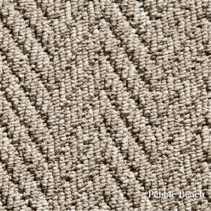 Close-up of textured beige carpet with 'Pebble Beach' label