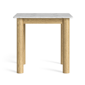 The Phoenix Bistro Table in oak with a marble top blends modern style and practicality, perfect for kitchens, breakfast areas or compact dining spaces