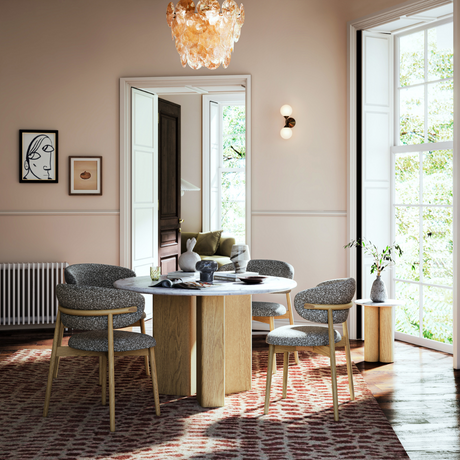 The Phoenix Round Dining Table pairs a marble top with a natural oak base with three column style legs, creating a stylish centrepiece for everyday dining