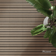 Wooden deck with horizontal slats and a plant in the corner, featuring the brand 'Picasso'.