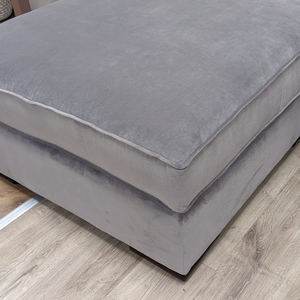 The Pillow Top Footstool in Grey with plush cushioned top, versatile design and durable fabric, perfect as a footrest, extra seat or casual coffee table