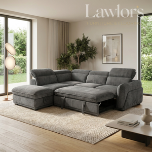 A large L-shaped sectional sofa in dark gray microfiber fabric, shown in a modern living room setting with a chaise lounge on the left, under a coffee table