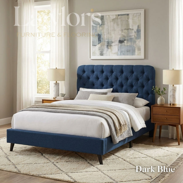 Prescott Bedframe in Dark Blue with plush buttoned headboard, soft fabric base and dark wooden legs.