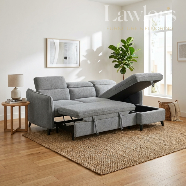 Grey sectional RHF sofa bed with storage drawers in a living room setting