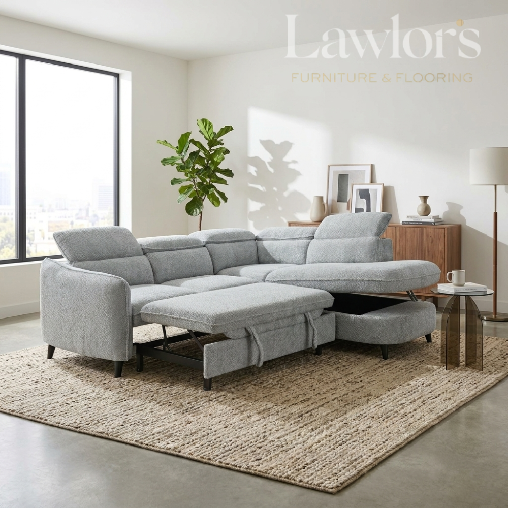 Grey sectional RHF corner sofa bed in a living room
