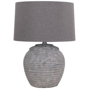 The Rosso Small Stone Table Lamp is crafted with quality and elegance in mind, featuring a stone base and minimalist design