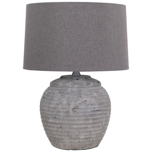 The Rosso Small Stone Table Lamp is crafted with quality and elegance in mind, featuring a stone base and minimalist design